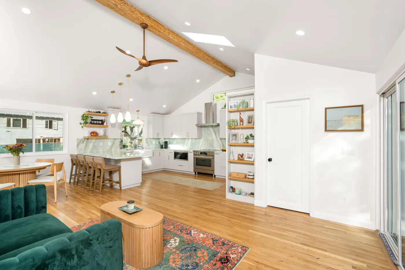 Premium kitchen and living room electrical install in Los Angeles — recessed lighting, designer ceiling fan, brass pendant cluster